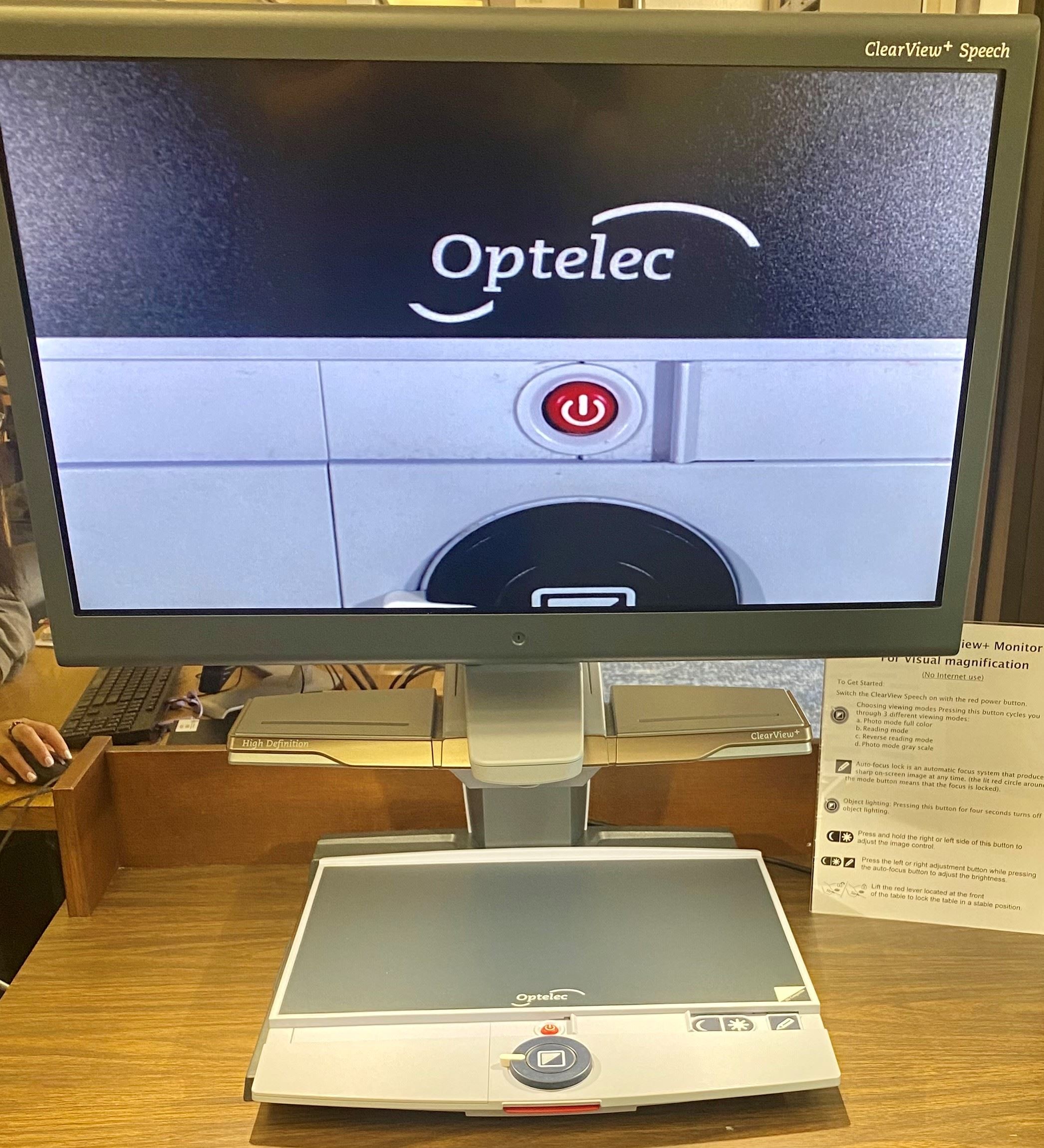 Picture of our Optelec clear vision screen magnifying monitor sitting on a desk in our O'Connor R