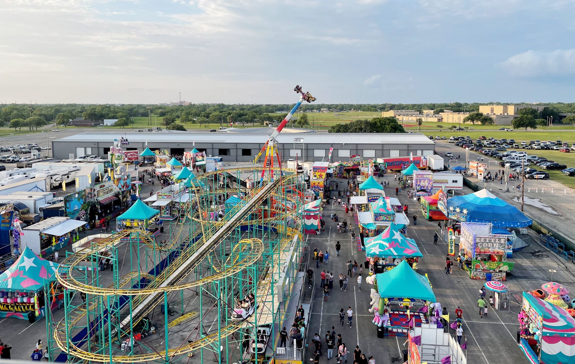 Aerial view of a large carnival at the Victoria Community Center grounds.