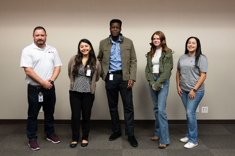 Group photo of five people
