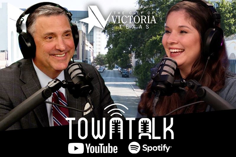 Mayor Duane Crocker and Ashley Strevel talking. Downtown backdrop. Town Talk. YouTube and Spotify.