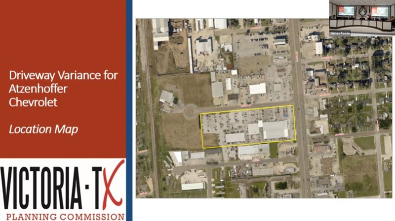 PowerPoint slide showing a bird's eye view of a car dealership